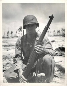Soldier with M1 Garand and hole in helmet